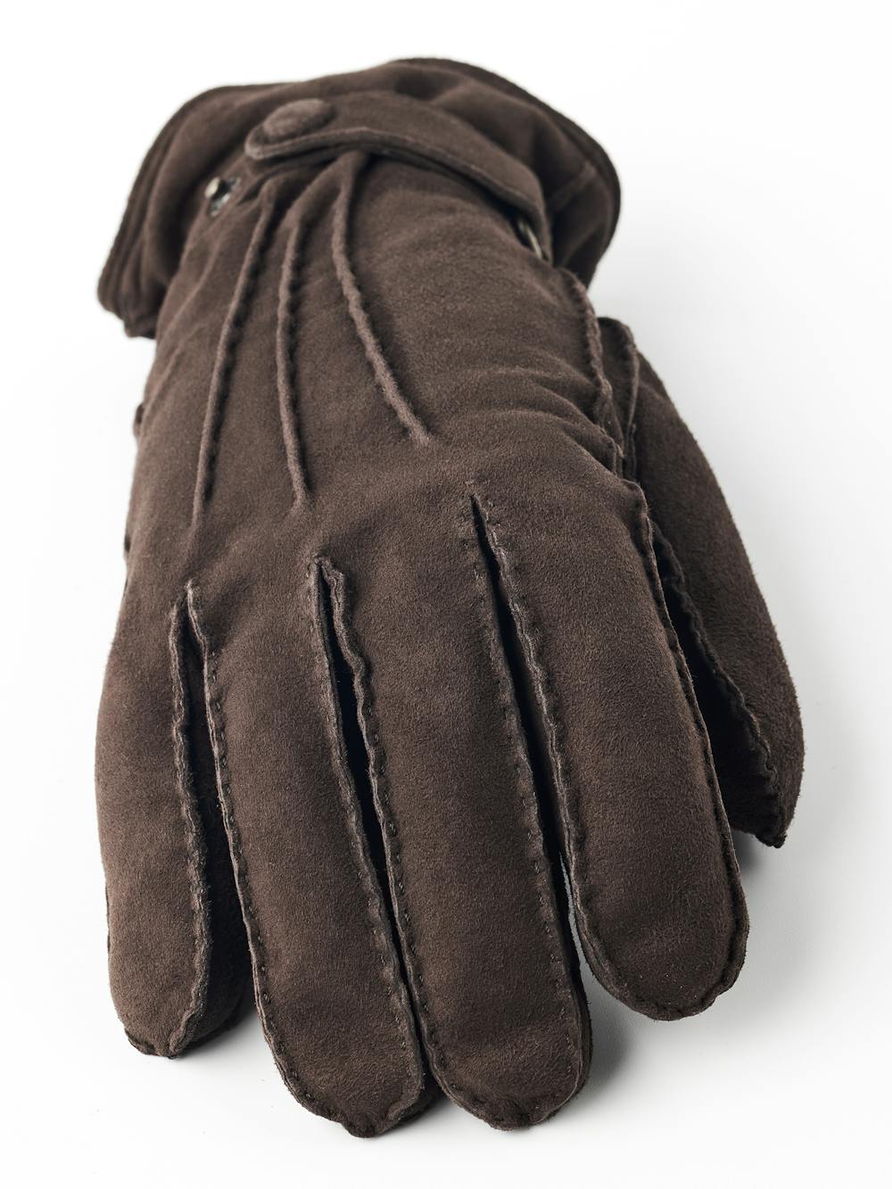 Dark brown hand-sewn suede glove with leather strap and button
 (2 of 5)