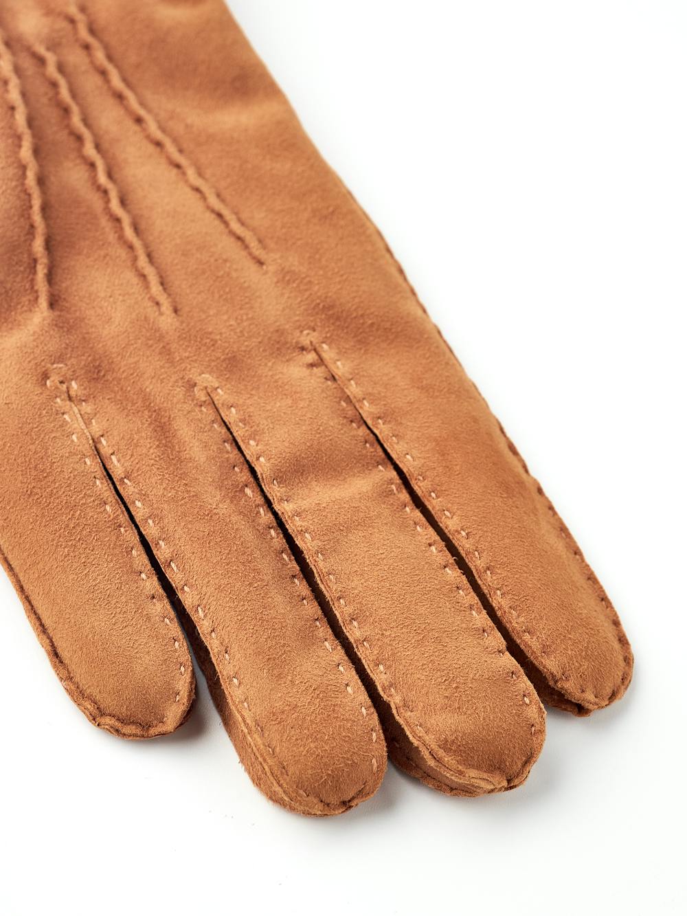 Light brown hand-sewn suede glove with leather strap and button
(2 of 7)