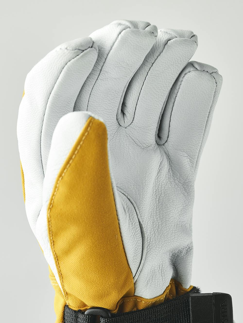Gelber Skihandschuh mit weißem Ziegenleder an der Innenhand
(7 oder 9)