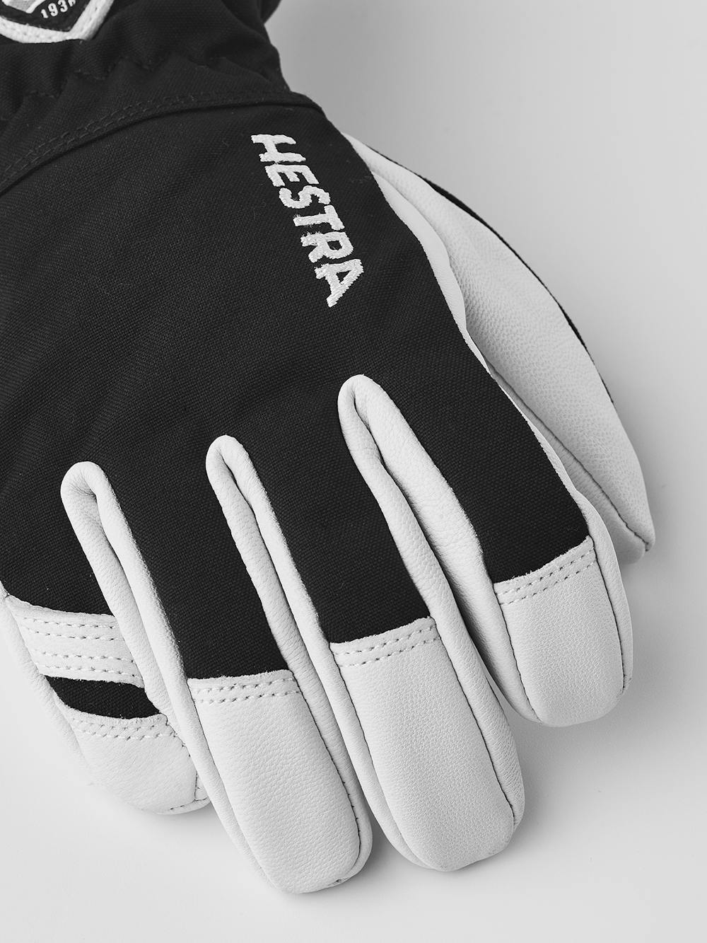 Schwarzer Skihandschuh mit weißem Ziegenleder an der Innenhand
(2 oder 6)