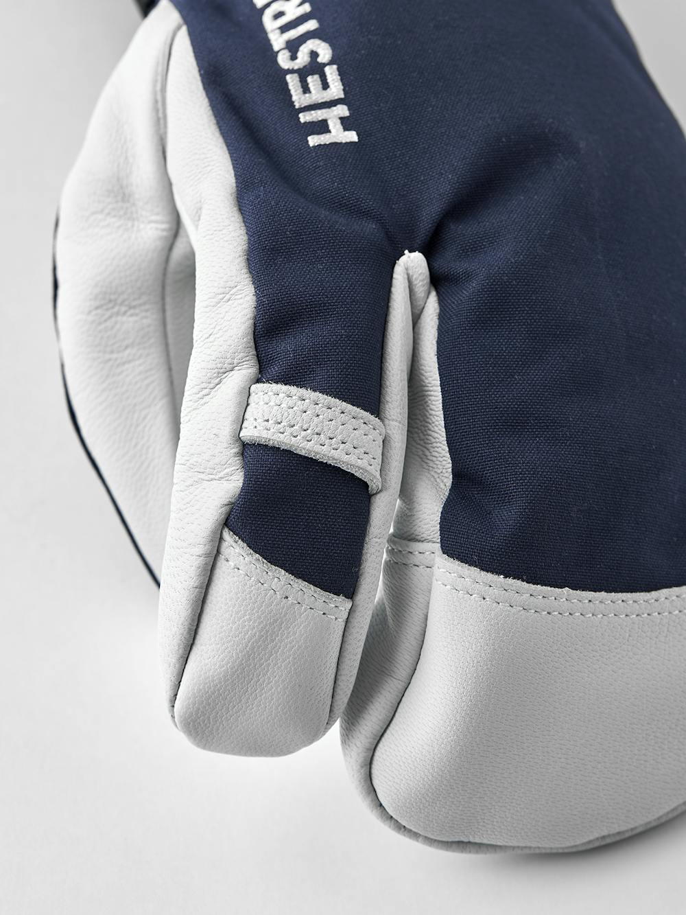 Dark blue three finger glove with white goat leather palm
(5 of 6)