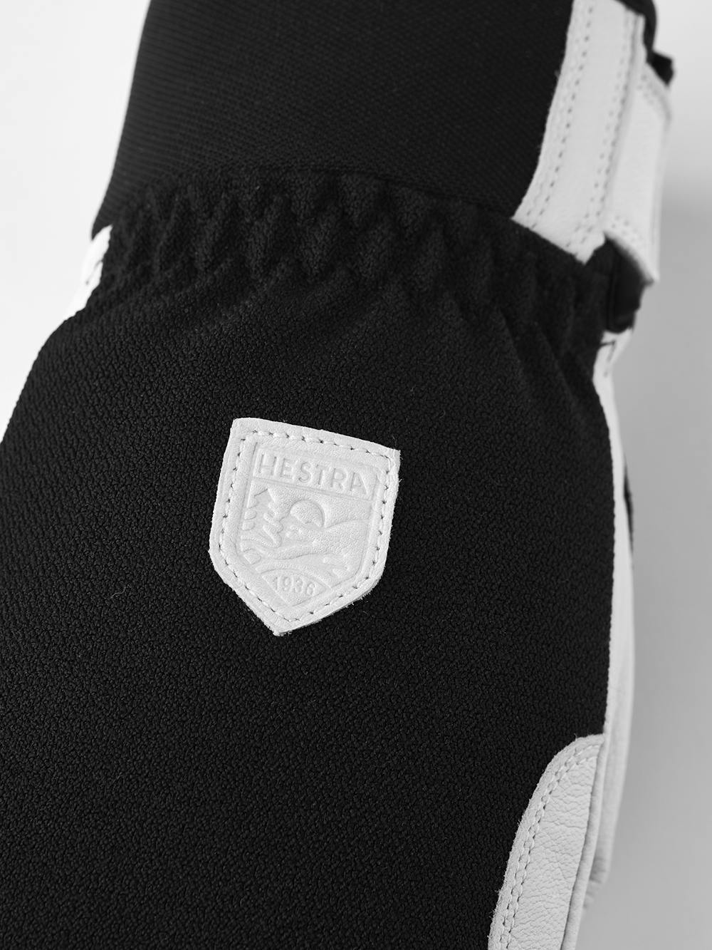 Schwarzer Fausthandschuh mit weißem Ziegenleder an der Innenhand
 (3 oder 5)