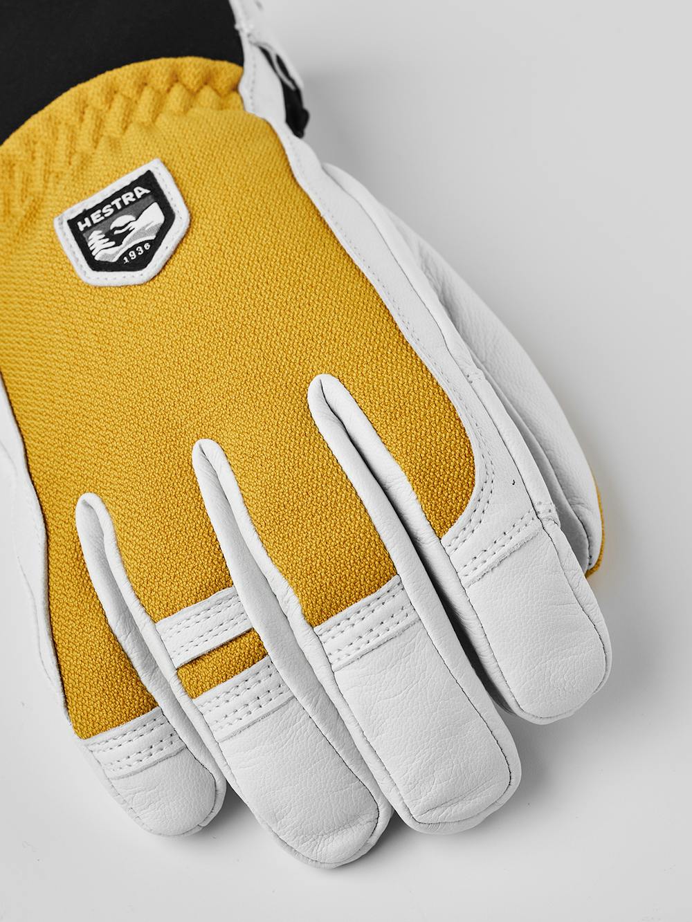 Gelber Skihandschuh mit weißem Ziegenleder an der Innenhand
(5 oder 10)