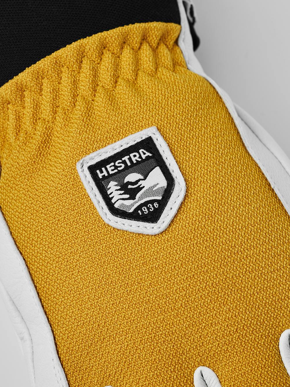 Gelber Skihandschuh mit weißem Ziegenleder an der Innenhand
(3 oder 10)