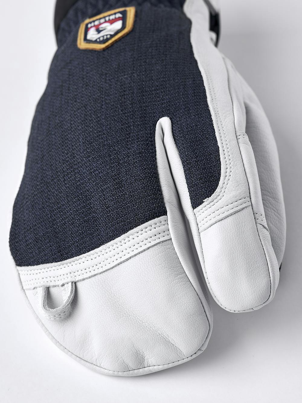 Dark blue three finger glove with white goat leather palm
 (2 of 5)