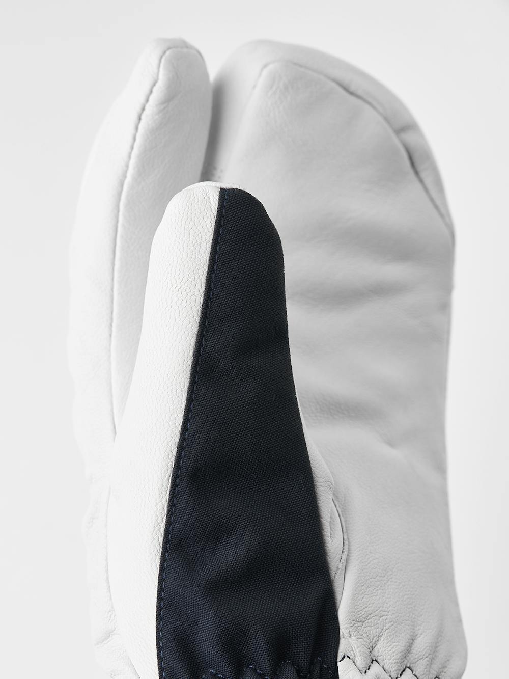 Dunkelblauer Dreifingerhandschuh mit weißem Ziegenleder an der Innenhand
 (5 oder 7)