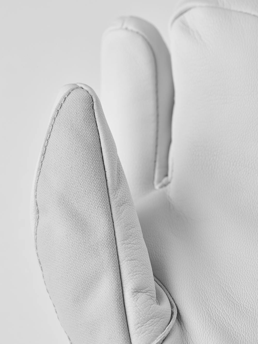 Light gray three finger glove with white goat leather palm
 (4 of 7)