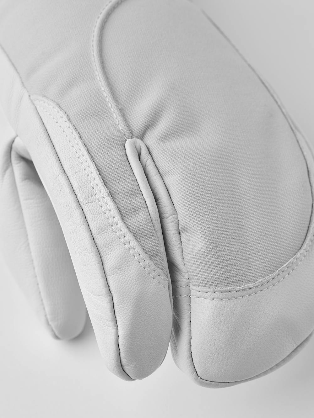 Light gray three finger glove with white goat leather palm
 (3 of 7)