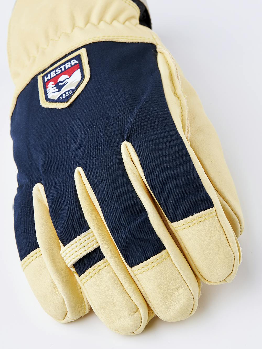 Gelber Skihandschuh aus Rindsleder mit Oberhand aus blauem Stoff
 (3 oder 9)