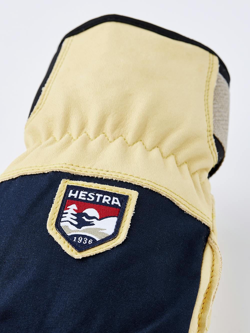 Gelber Skihandschuh aus Rindsleder mit Oberhand aus blauem Stoff
(4 oder 9)