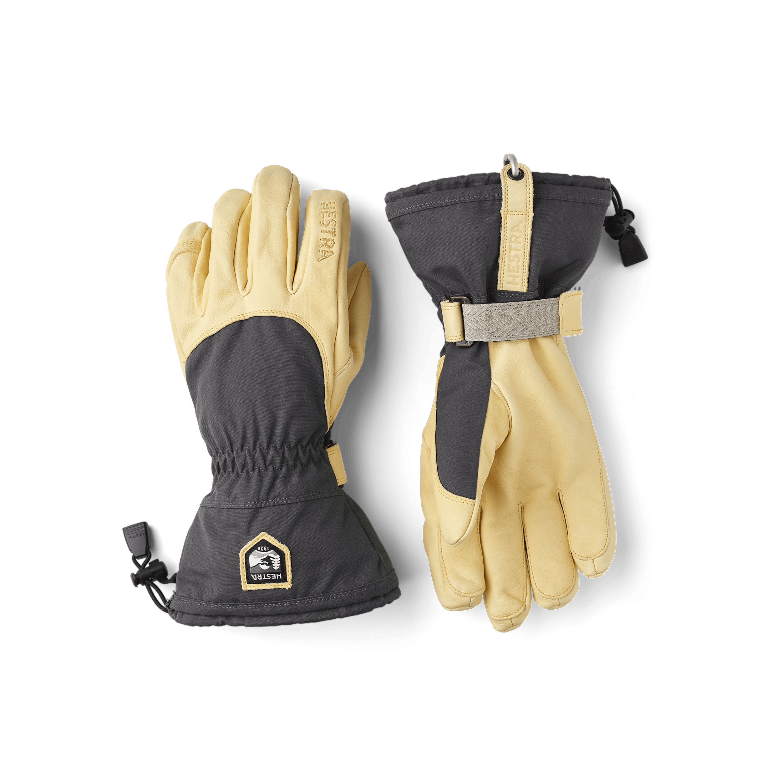 Grå skidhandske med gul nötnappa i innerhanden
(1 av 8)