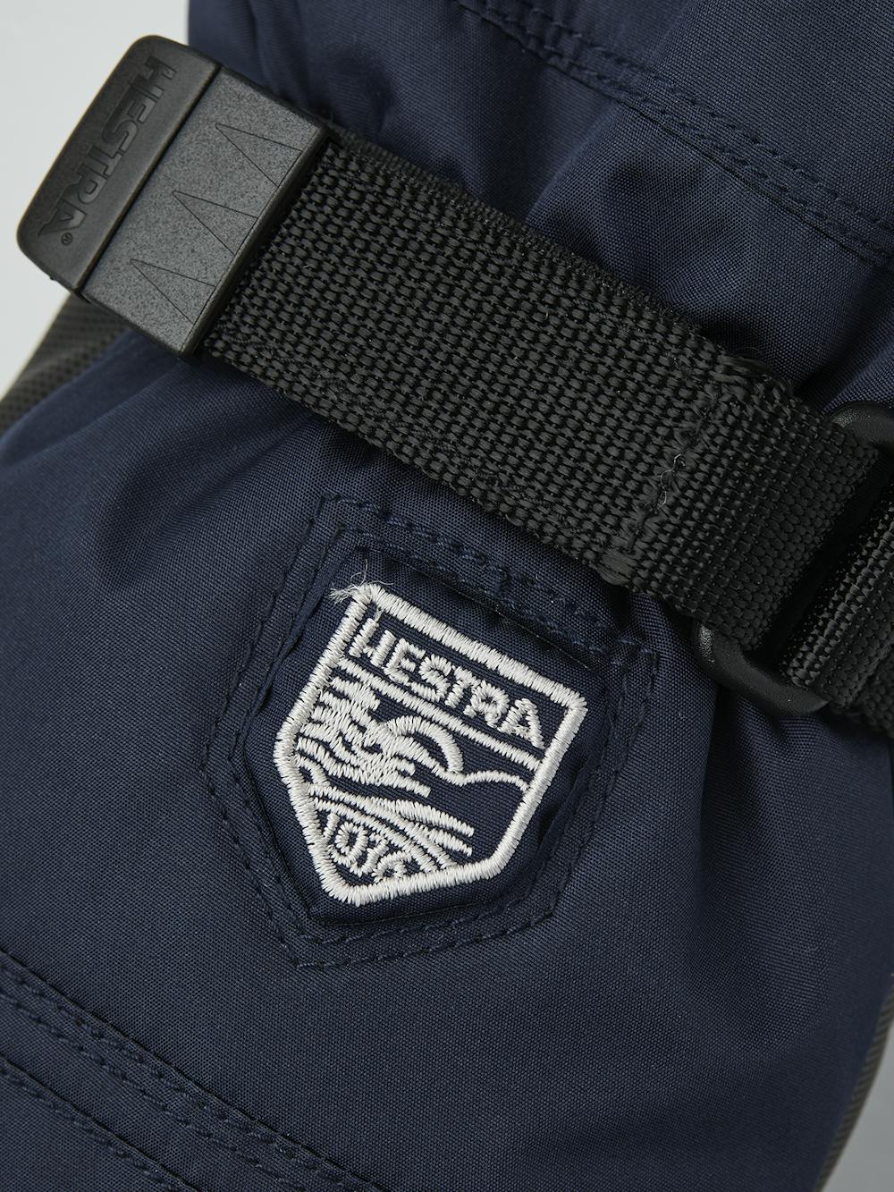 Dunkelblauer Fausthandschuh aus Stoff mit schwarzer Innenhand aus Synthetikmaterial und verstellbarem Handgelenkverschluss (4 oder 4)