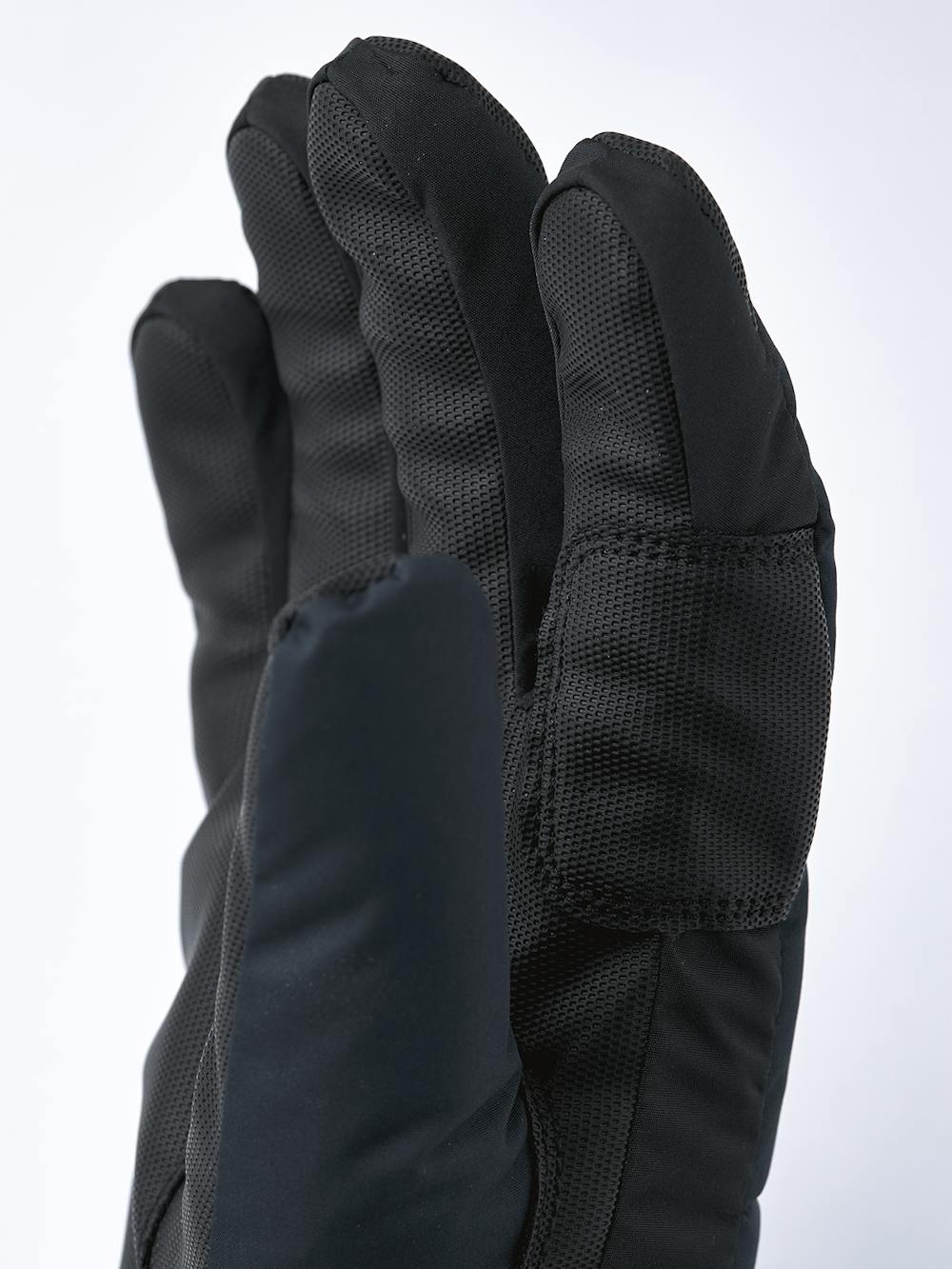 Mörkblå skidhandske i tyg med svart innerhand i syntetmaterial
 (2 av 5)