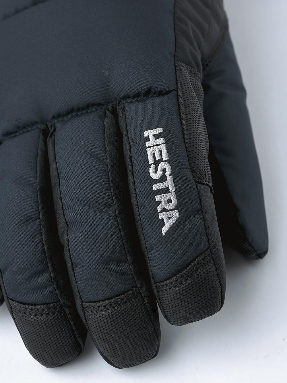 Mörkblå skidhandske i tyg med svart innerhand i syntetmaterial
 (3 av 5)