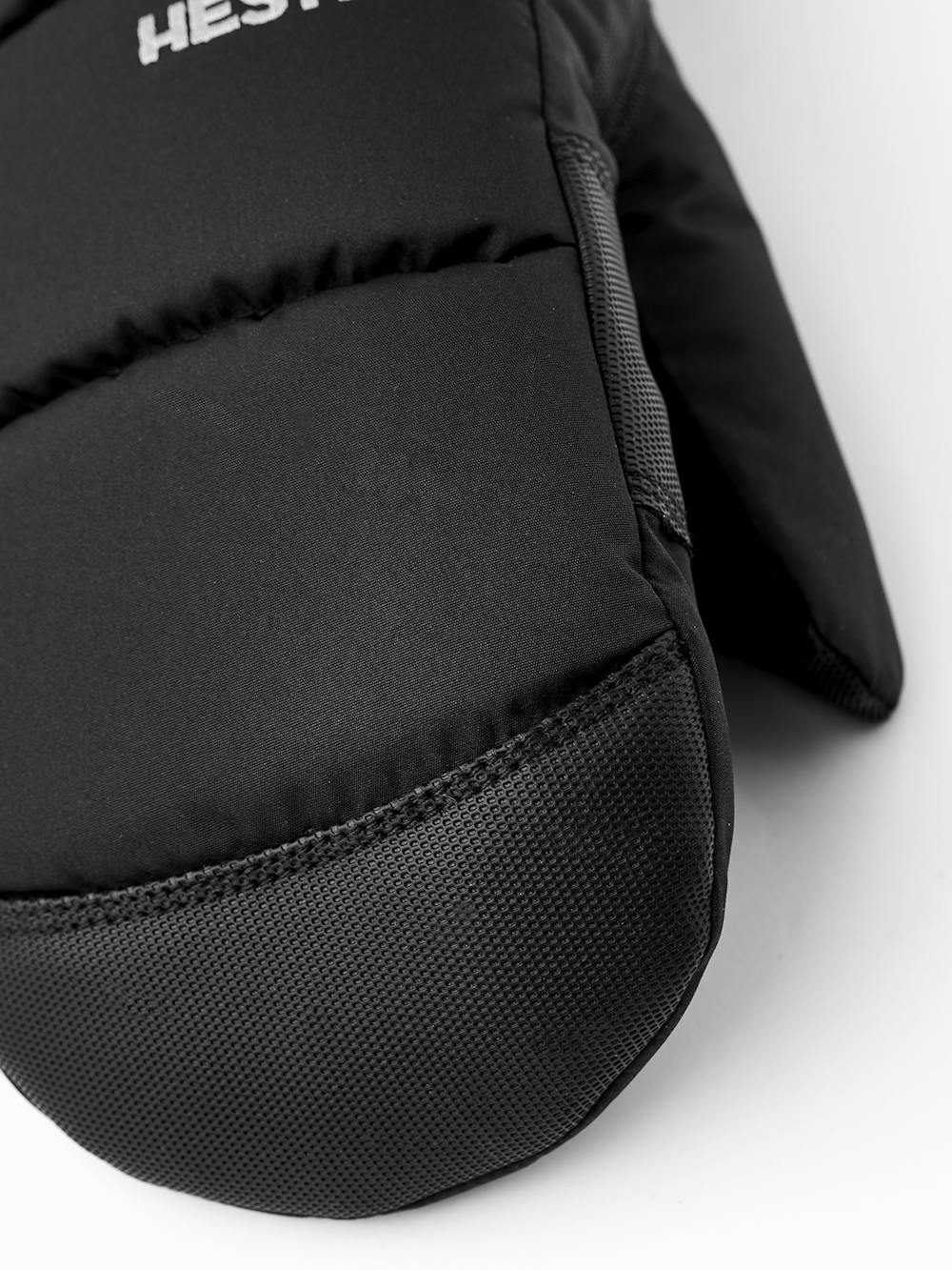 Svart tumhandske i tyg med svart innerhand i syntetmaterial
(3 av 6)