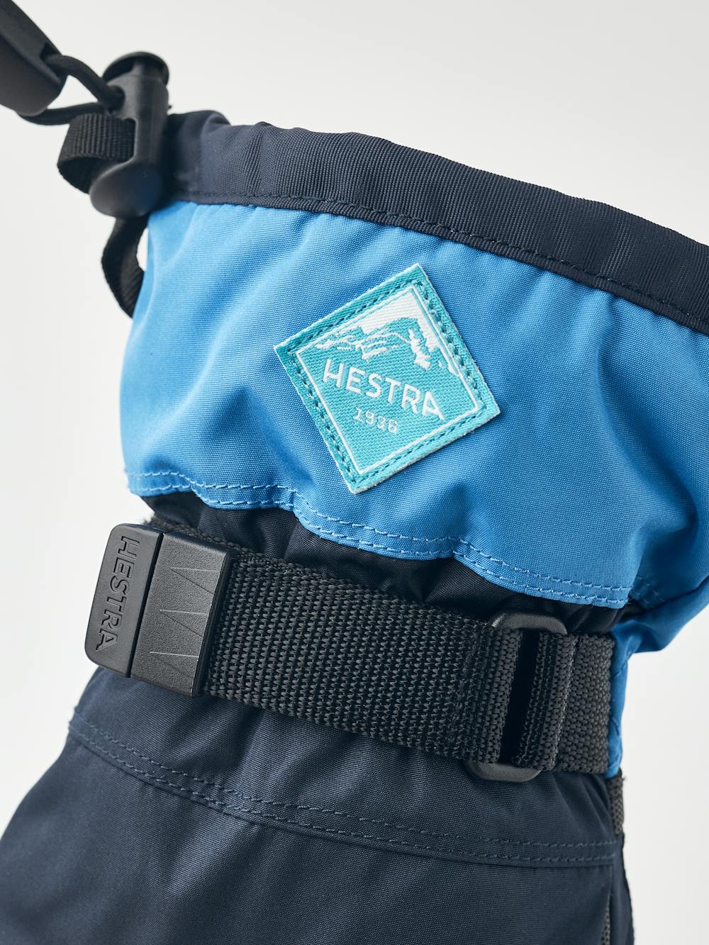 Blue children’s glove with black synthetic palm and wrist adjustment (3 of 5)