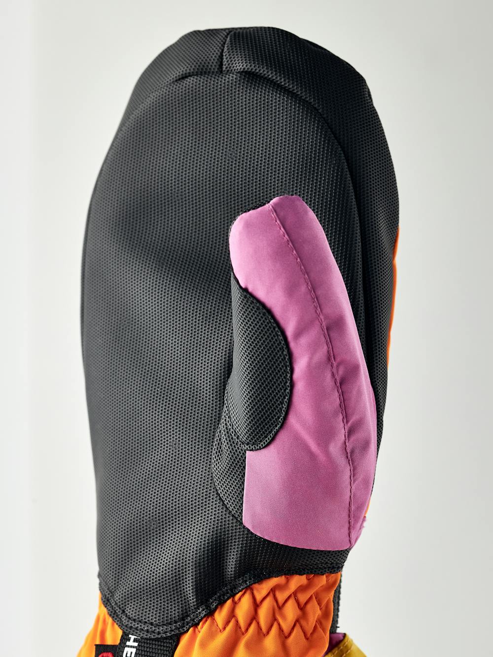 Orange-rosa Fausthandschuh mit schwarzem Synthetikmaterial an der Innenhand und verstellbarem Handgelenkverschluss (6 oder 6)