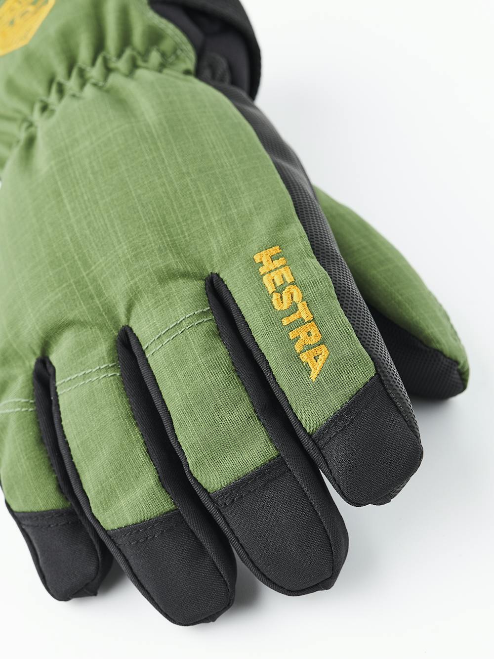 Green fabric children’s glove with black palm (5 of 7)