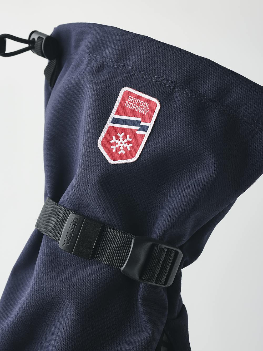 Dark blue shell glove with black fabric palm and wrist adjustment (2 of 5)