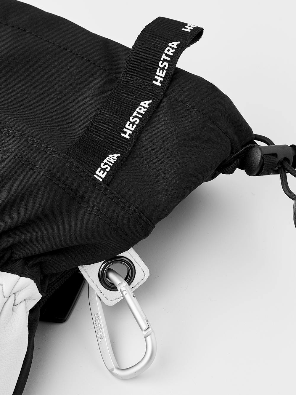 Schwarzer Fausthandschuh mit weißem Ziegenleder an der Innenhand und verstellbarem Handgelenkverschluss (7 oder 10)