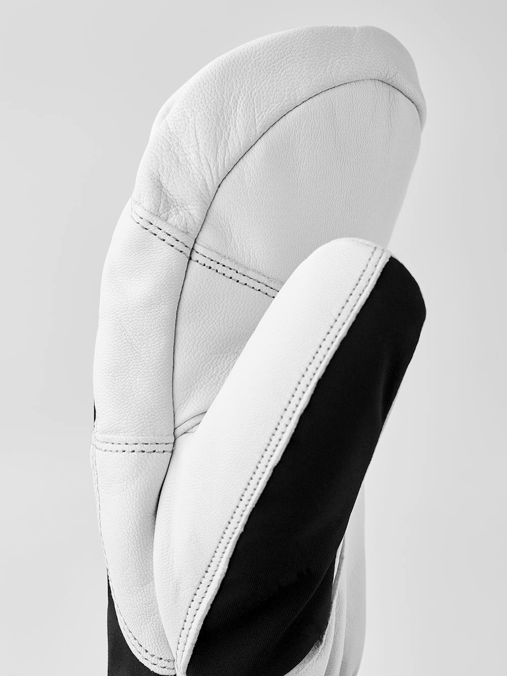 Schwarzer Fausthandschuh mit weißem Ziegenleder an der Innenhand und verstellbarem Handgelenkverschluss (3 oder 10)