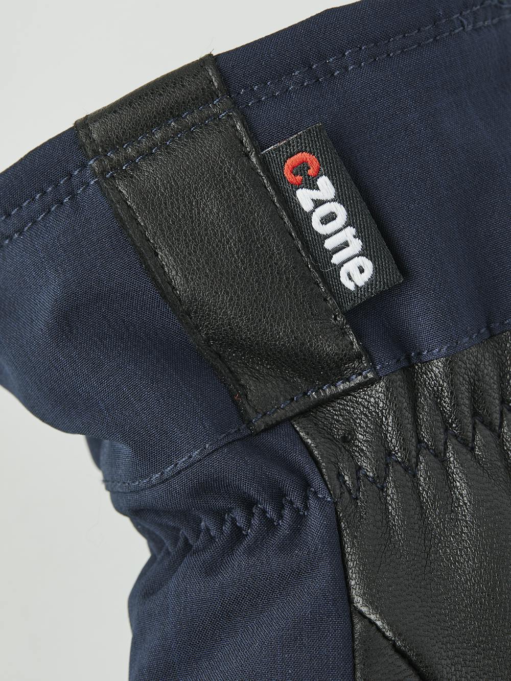 Mörkblå tumhandske med svart getskinn i innerhanden
(2 av 4)