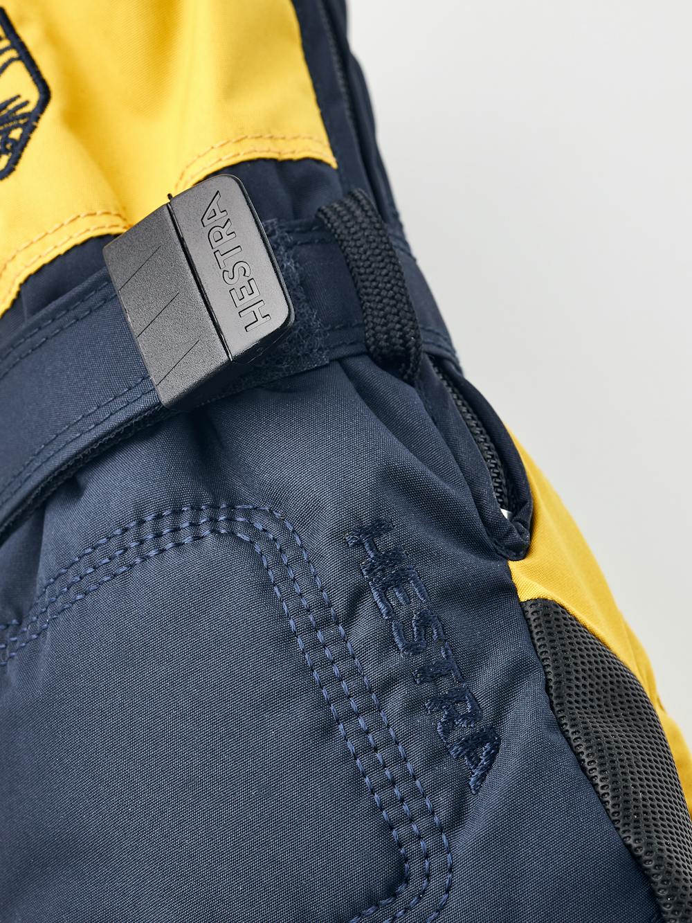 Dark blue and yellow fabric mitten with black palm and wrist adjustment (3 of 4)