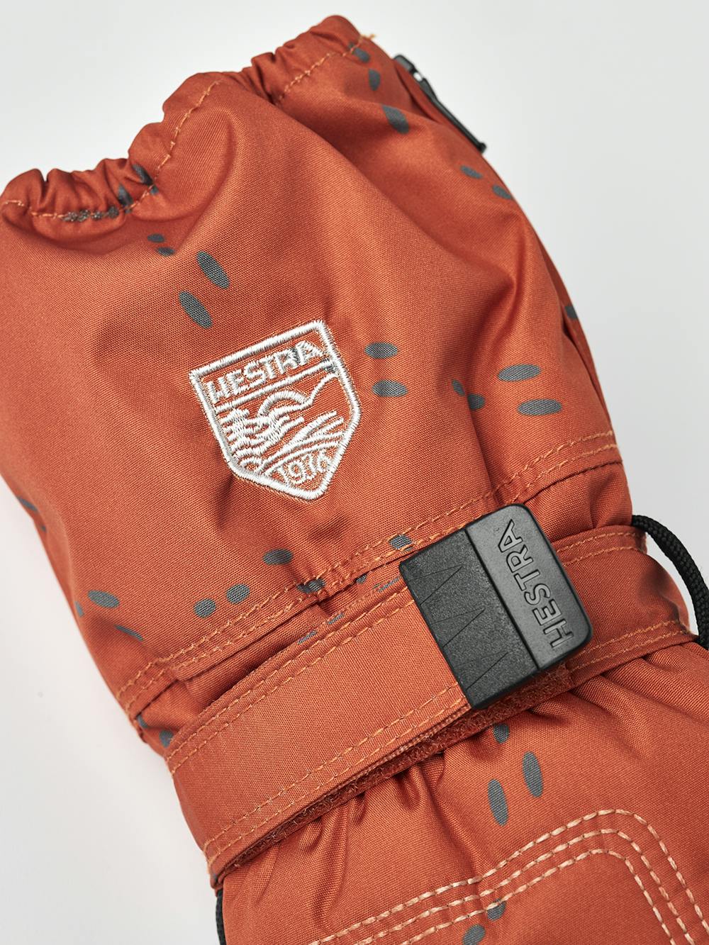 Orange print fabric mitten design with black palm and wrist adjustment (4 of 5)