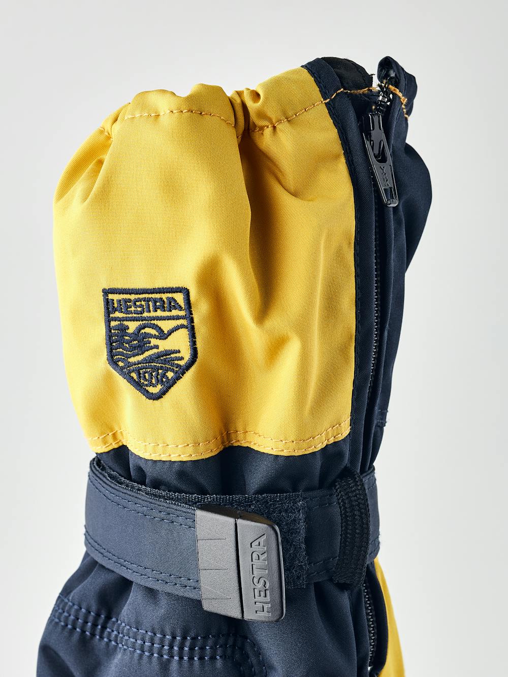 Dark blue and yellow fabric mitten with black palm and wrist adjustment (4 of 4)