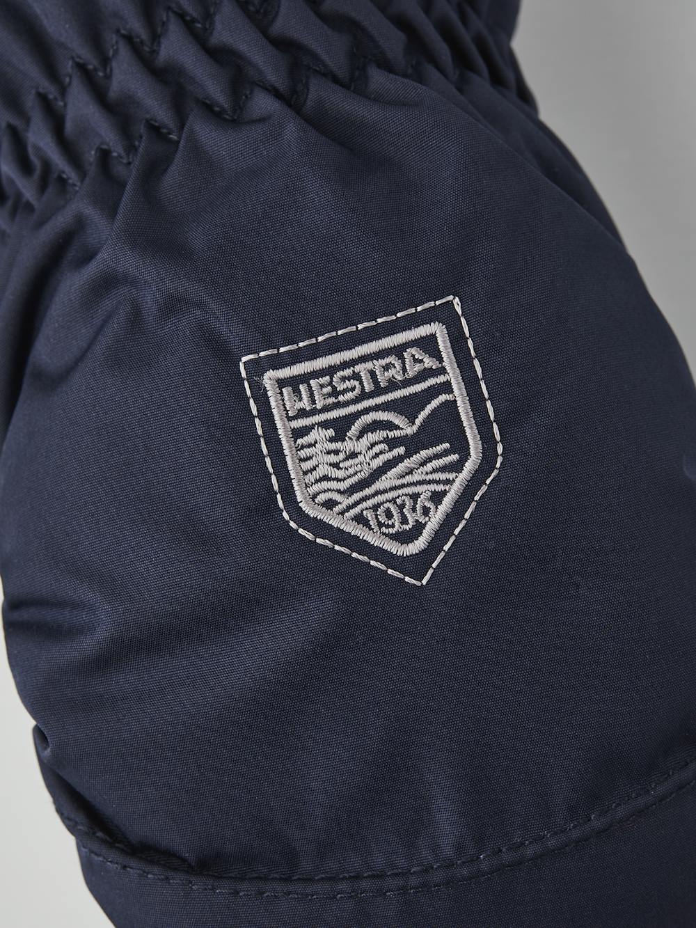 Dark blue fabric mitten with gray cuff and white hairsheep palm (3 of 4)