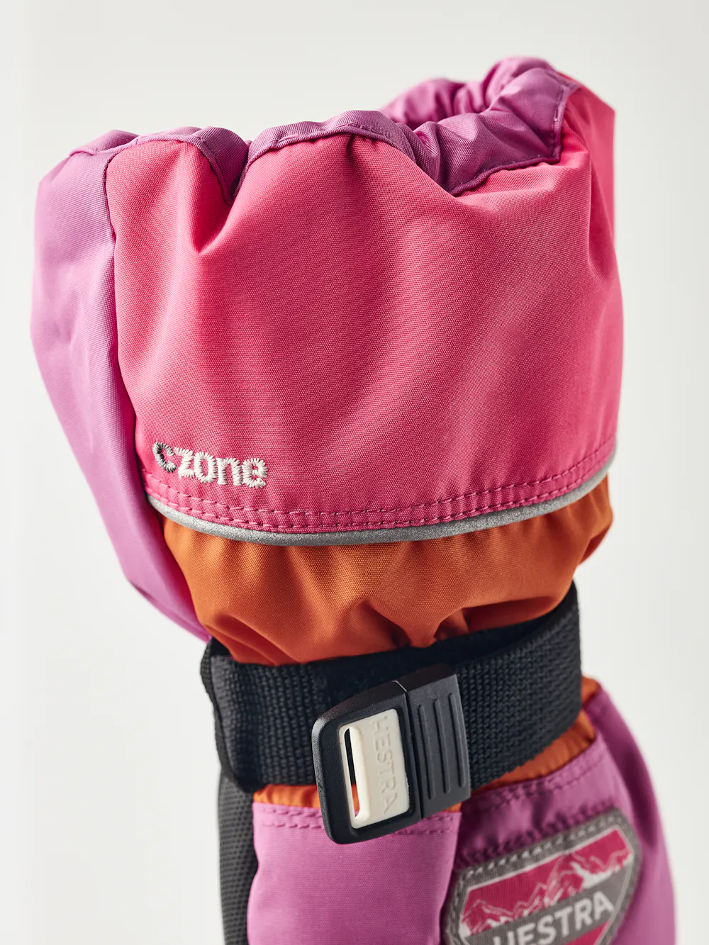 Orange and pink fabric mitten with black synthetic palm and wrist adjustment  (5 of 5)