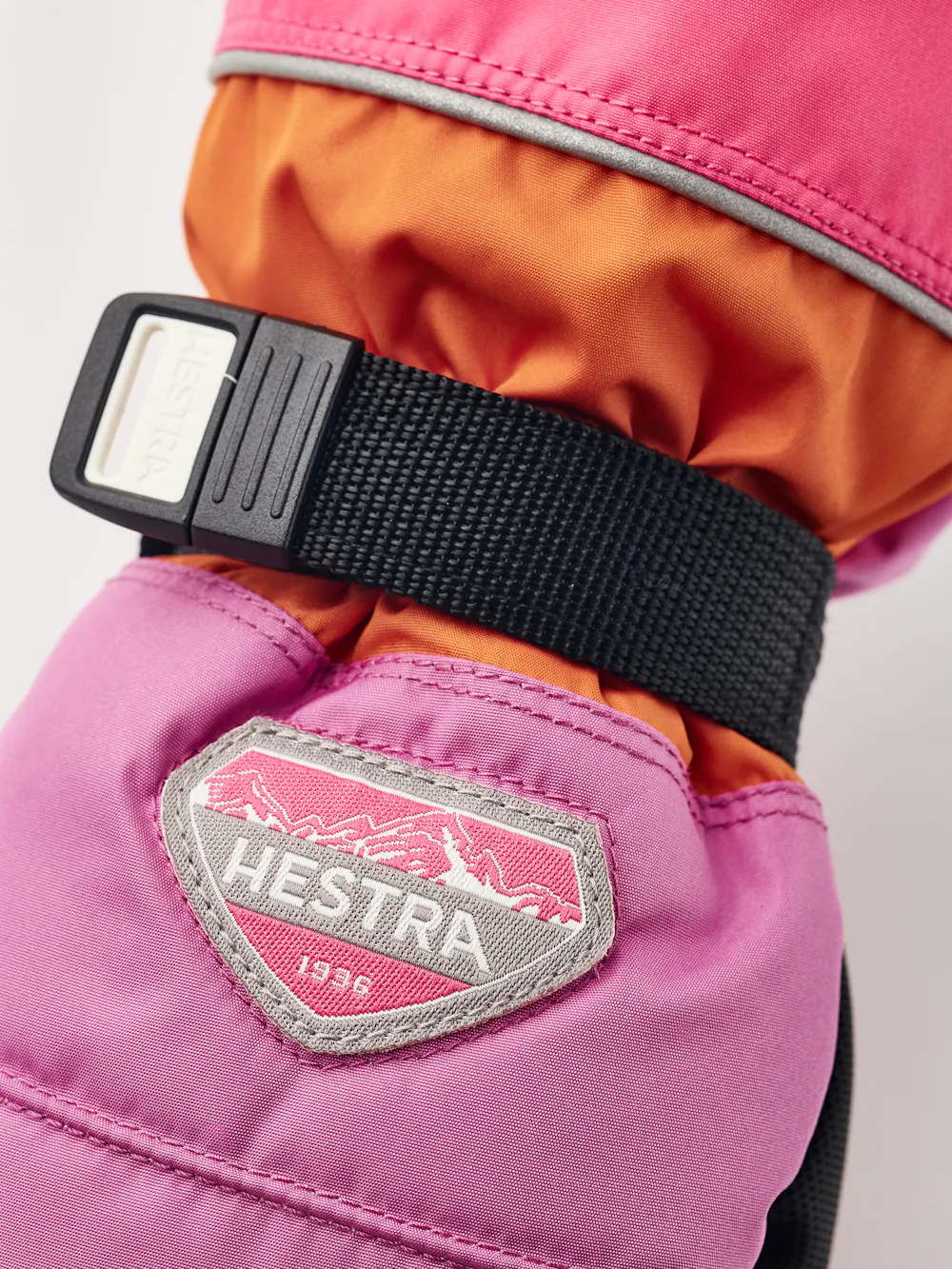 Orange and pink fabric mitten with black synthetic palm and wrist adjustment  (4 of 5)