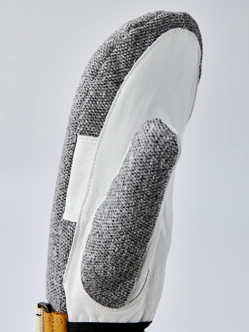 Grauer Fausthandschuh mit weißem Ziegenleder an der Innenhand und verstellbarem Handgelenkverschluss (7 oder 8)