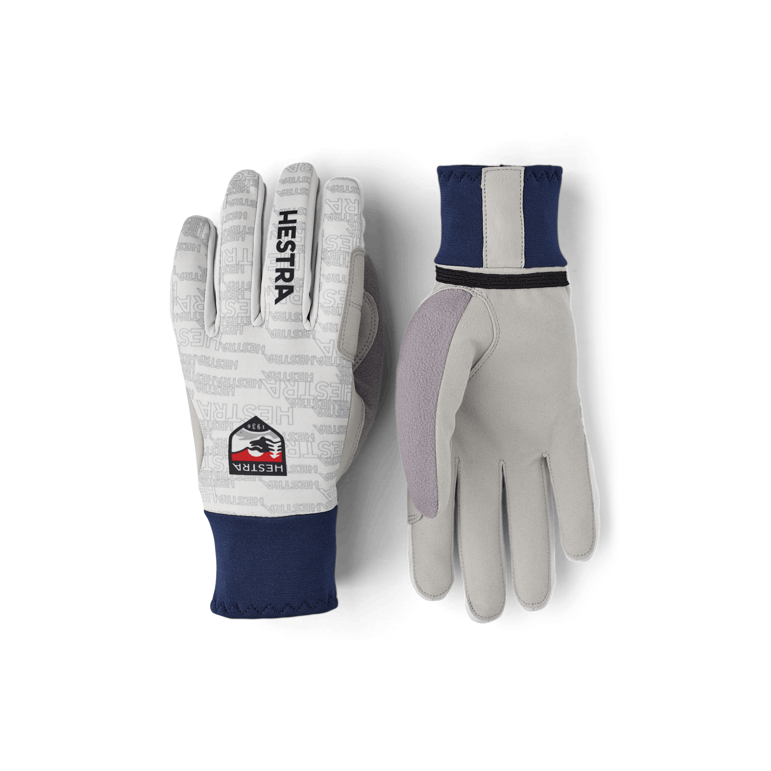 Vit och blå längdskidhandske i tyg med grå innerhand i syntetisk mocka
(1 av 5)