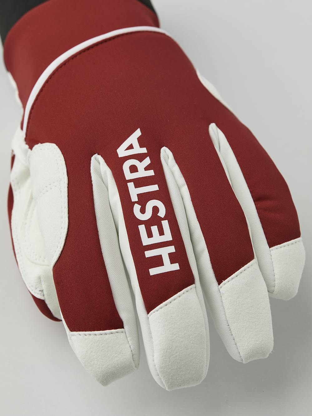 Red fabric cross-country ski glove with white synthetic suede palm (5 of 5)