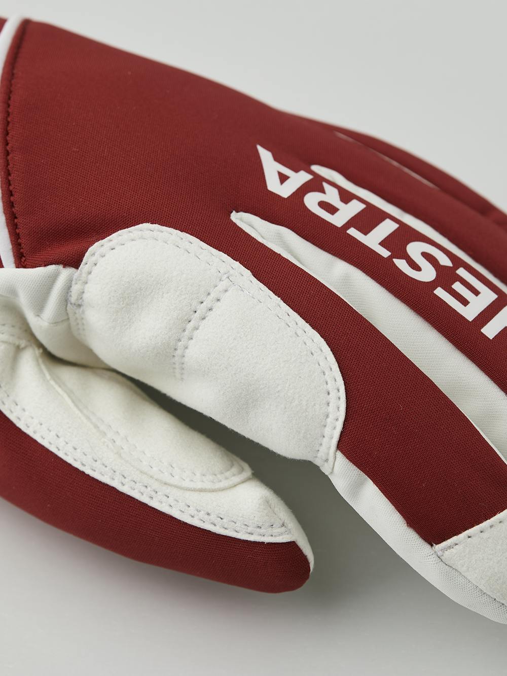 Red fabric cross-country ski glove with white synthetic suede palm (2 of 5)