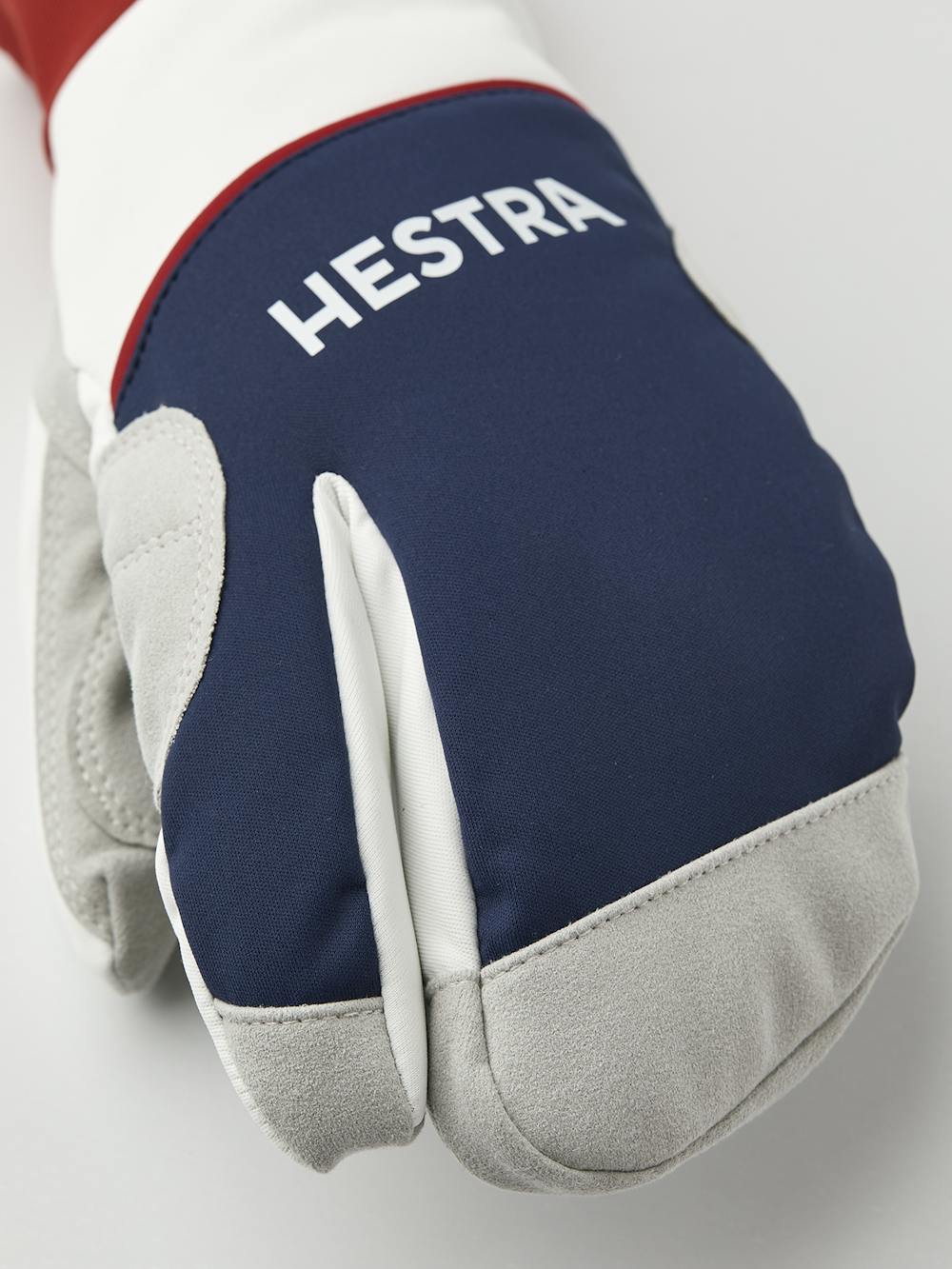 Blå och röd trefingershandske i tyg med grå innerhand i syntetisk mocka
(3 av 5)