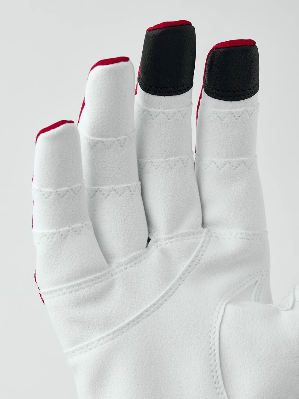 Röd och blå cykelhandske med lycra på bakhanden och vit syntetisk mocka i innerhanden
(4 av 5)