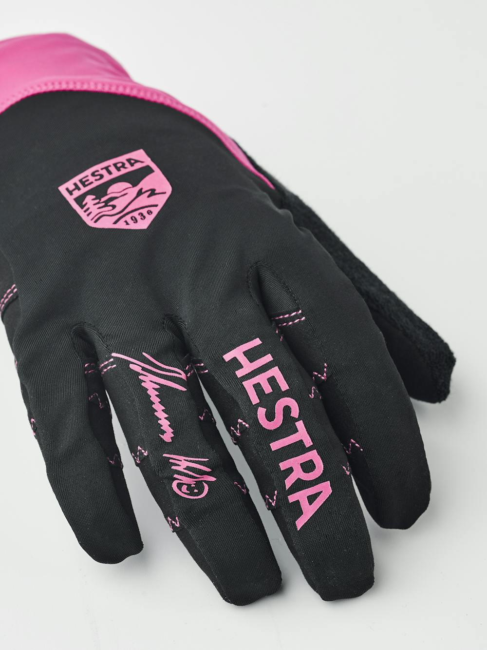 Rosa-schwarzer Fahrradhandschuh mit Lycra an der Oberhand und schwarzem synthetischem Wildleder an der Innenhand (2 oder 5)