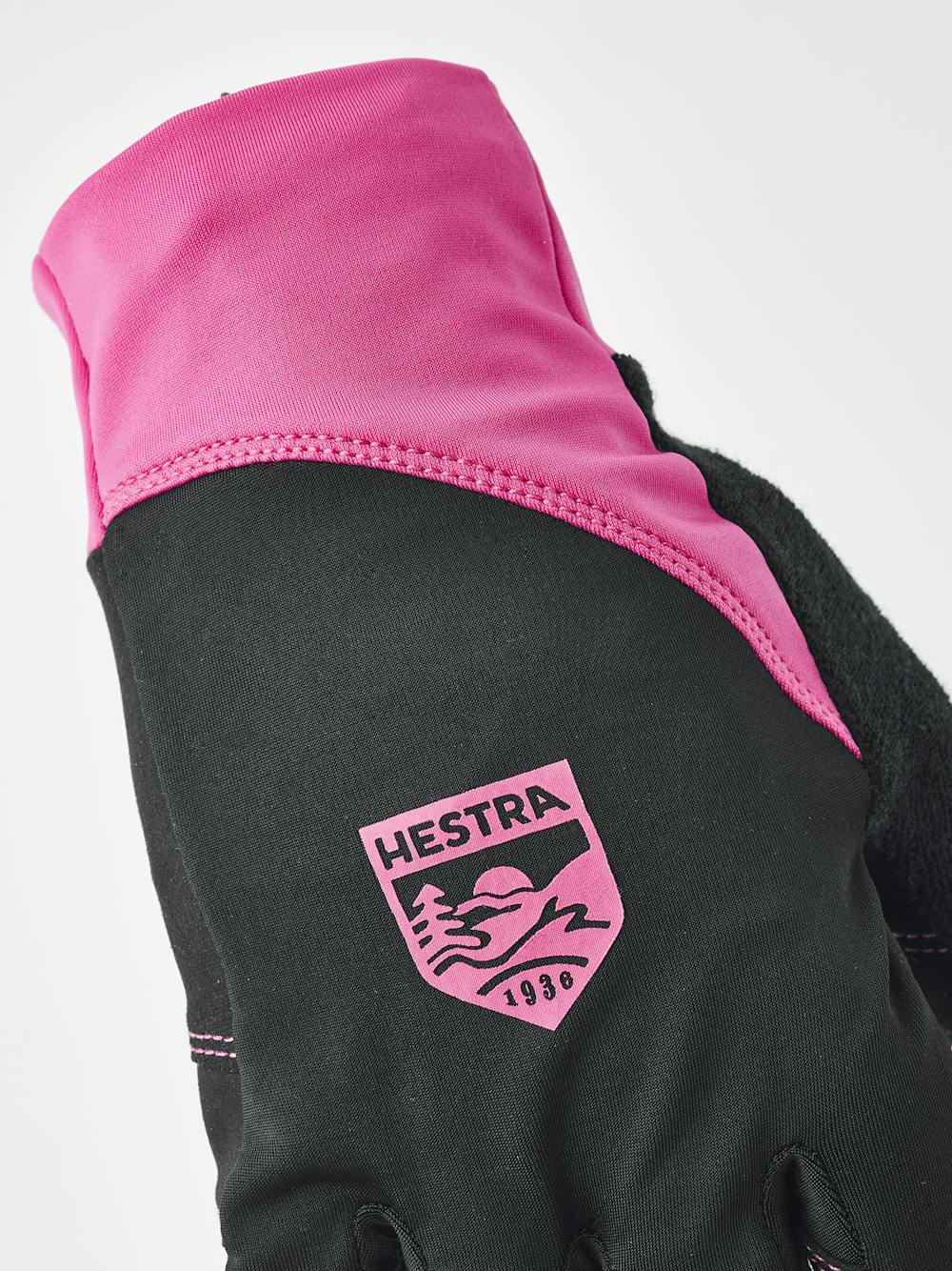 Rosa-schwarzer Fahrradhandschuh mit Lycra an der Oberhand und schwarzem synthetischem Wildleder an der Innenhand (4 oder 5)