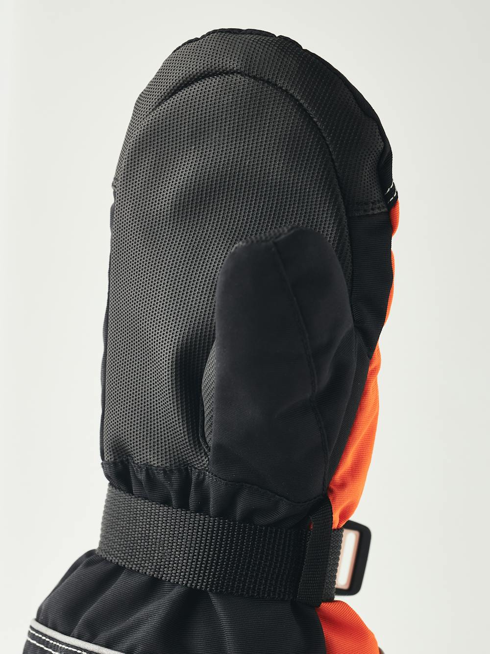 Orange fabric mitten with black synthetic palm and wrist adjustment (3 of 4)