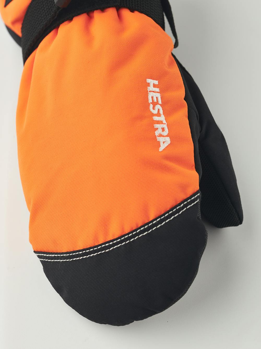 Orange fabric mitten with black synthetic palm and wrist adjustment (2 of 4)