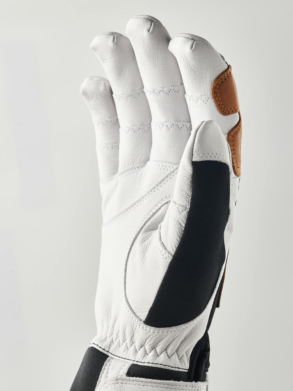 Black glove with white goat leather palm
(2 of 5)