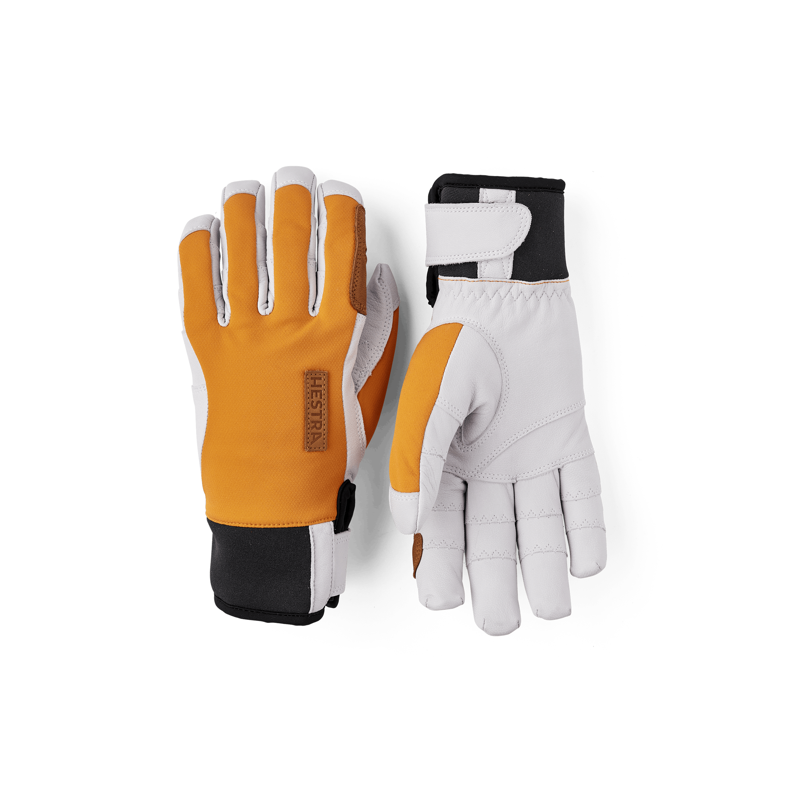 Orange handske med vitt getskinn i innerhanden
(1 av 8)