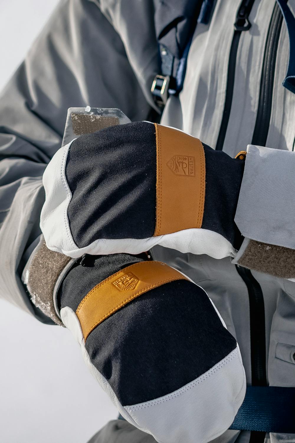 Black mitten with white goat leather palm and wrist strap (9 of 9)