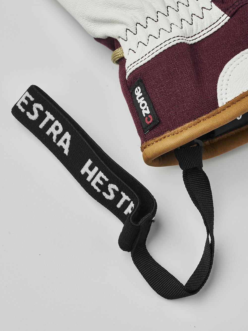 Bordeauxroter Fausthandschuh mit weißem Ziegenleder an der Innenhand und Handgelenkschlaufe (9 oder 10)