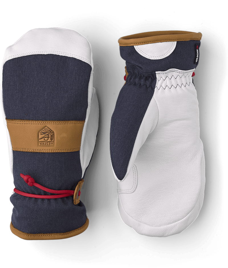 Mörkblå tumhandske med vitt getskinn i innerhanden och handledsrem
 (1 av 5)