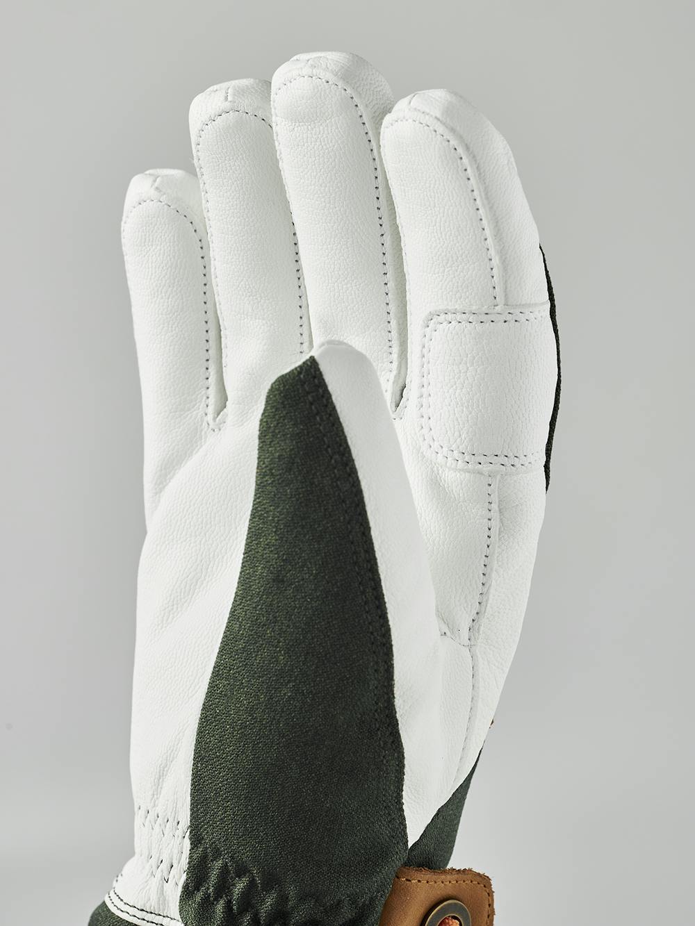 Dunkelgrüner Skihandschuh mit weißem Ziegenleder an der Innenhand und Handgelenkschlaufe (7 oder 11)