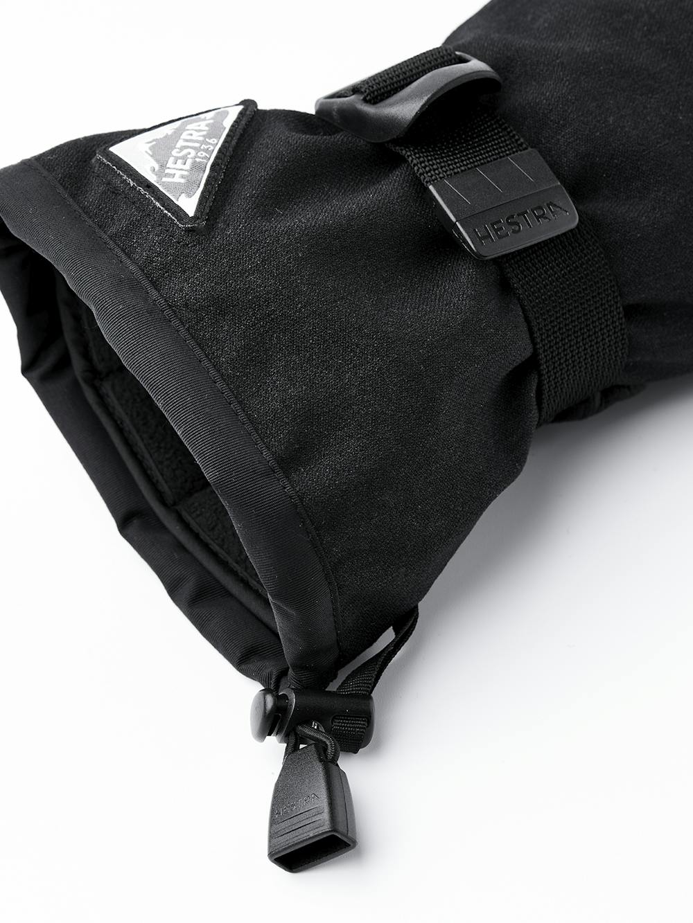 Svart tumhandske med svart getskinn i innerhanden och handledsjustering
(5 av 5)