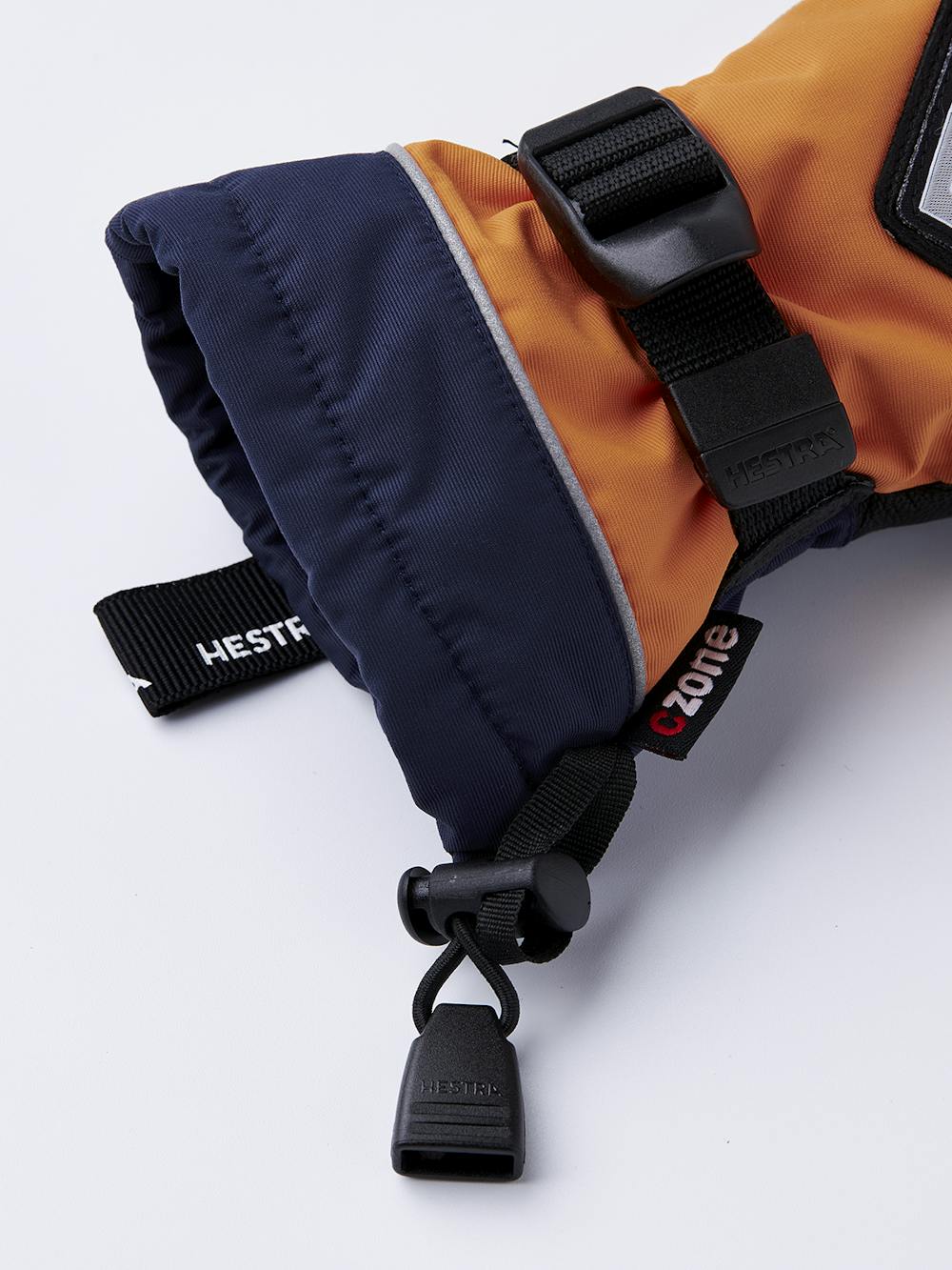 Oranger Kinderhandschuh mit schwarzem Ziegenleder an der Innenhand und verstellbarem Handgelenkverschluss (5 oder 8)